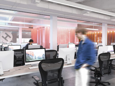 Modern open workspace at Hive Helsinki with computers ready for students to code and collaborate.