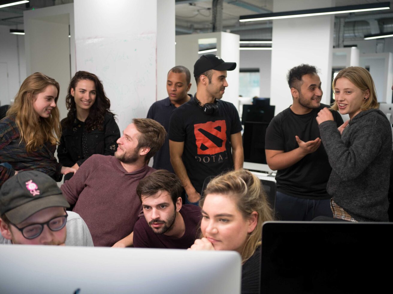 A group of Hive Helsinki students working together on a coding project