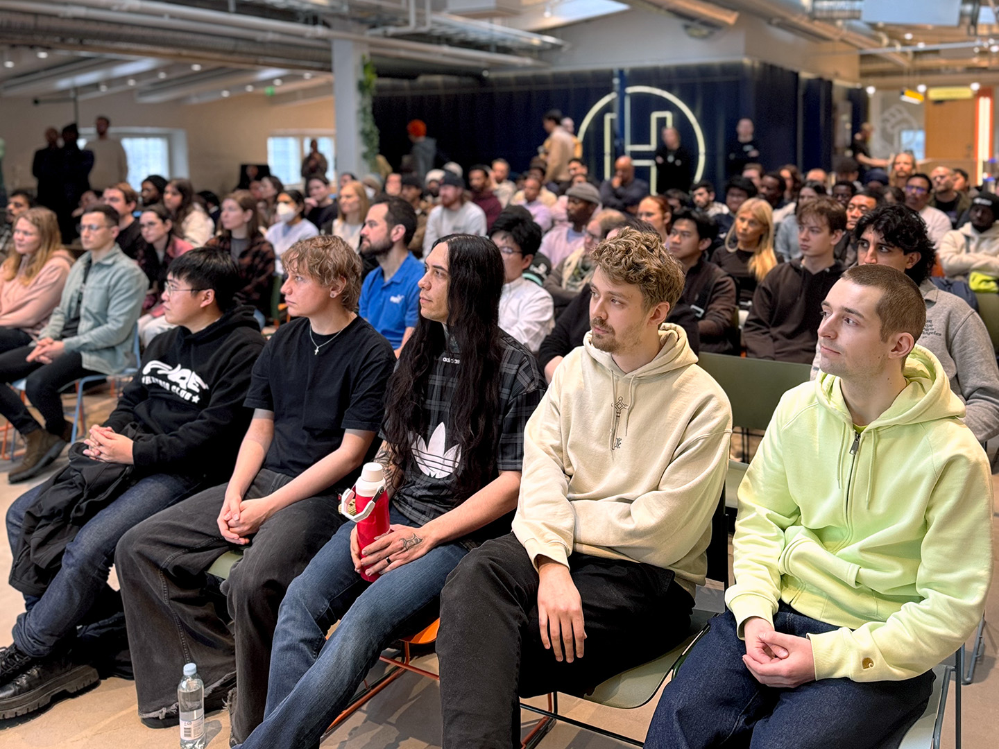 Selection Sprint applicants seated and listening during a group session at Hive